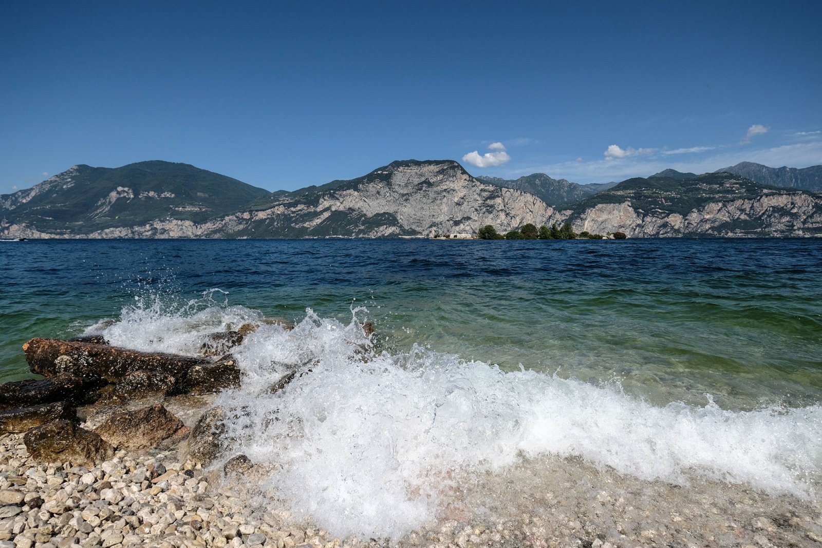 The beauty of rocky beaches and clear water in Brenzone at Lake Garda